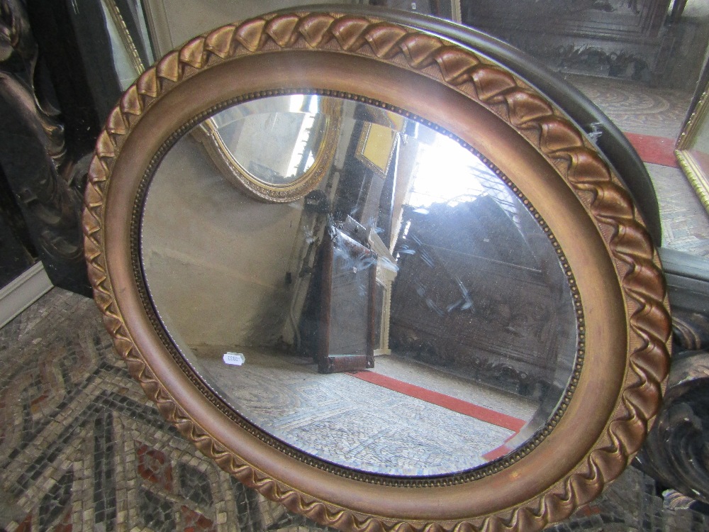 A small Dutch style wall mirror with bevelled edge rectangular plate, brass clad foliate surround - Image 2 of 2
