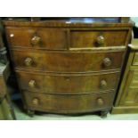 A 19th century mahogany and stained pine sided bow fronted bedroom chest of three long and two short