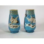 A pair of early 20th century Satsuma vases with enamelled style decoration of cranes on a