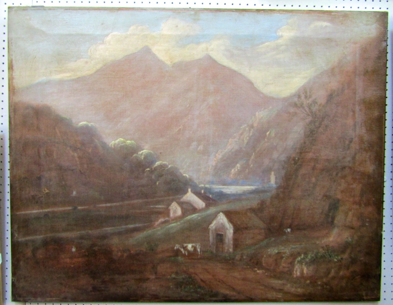 A 19th century oil painting on canvas of a mountainous landscape with cow and sheep to the
