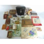 A miscellaneous collection including a mother of pearl opera glass, two small suede covered books,