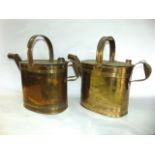 A pair of very large brass hot water cans with reeded detail