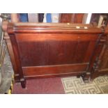 A 19th century continental mahogany bateau lit with scrolled top rails and well matched flame