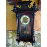 A late 19th century wall clock, the case with split spindle mouldings and further applied detail