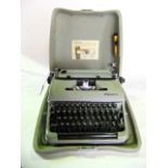 An Olympia manual typewriter model SM3 in travelling case in almost unused condition