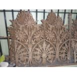 Eight sections of 19th century ornamental ironwork railing with pierced foliate detail, each section