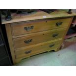 An Edwardian satin walnut dressing chest of three long drawers
