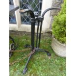 A reproduction cast iron garden or pub table base with shaped tripod supports