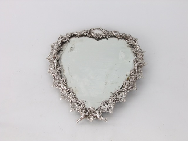 A good quality late 19th century heart shaped dressing table mirror, the silver plated frame