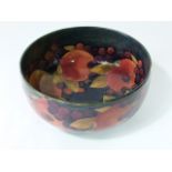 A large Moorcroft Pomegranate pattern fruit bowl with painted signature and impressed marks to base,