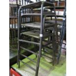 A stack of four steel framed ex school/laboratory stools with rectangular ply wood seats, central