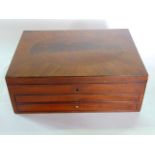 A Georgian mahogany box, the lid with oval inlaid panel over two frieze drawers