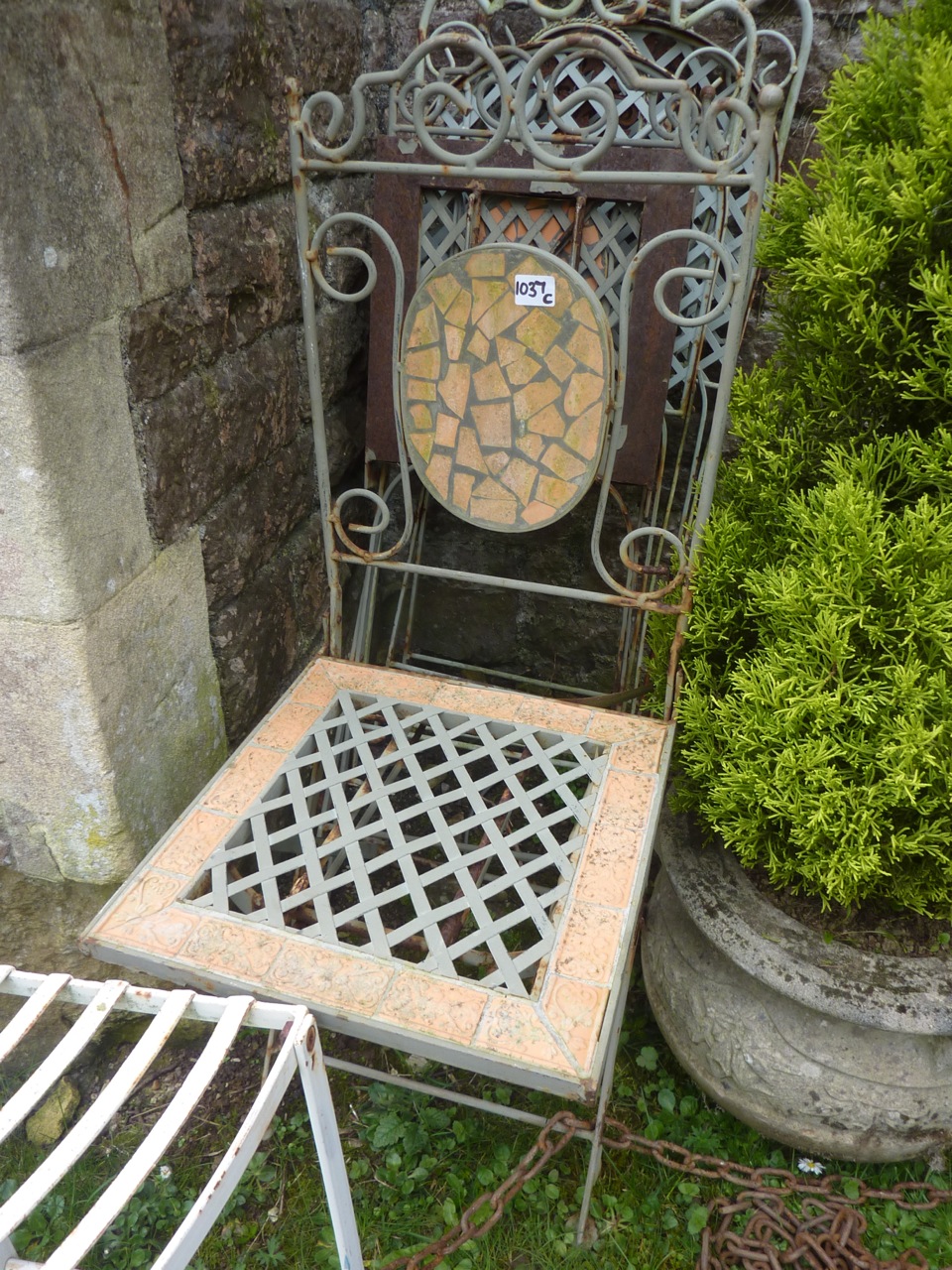 Two pairs of contemporary folding steel framed garden terrace chairs, with lattice work and scrolled