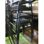 A stack of four steel framed ex school/laboratory stools with rectangular ply wood seats, central