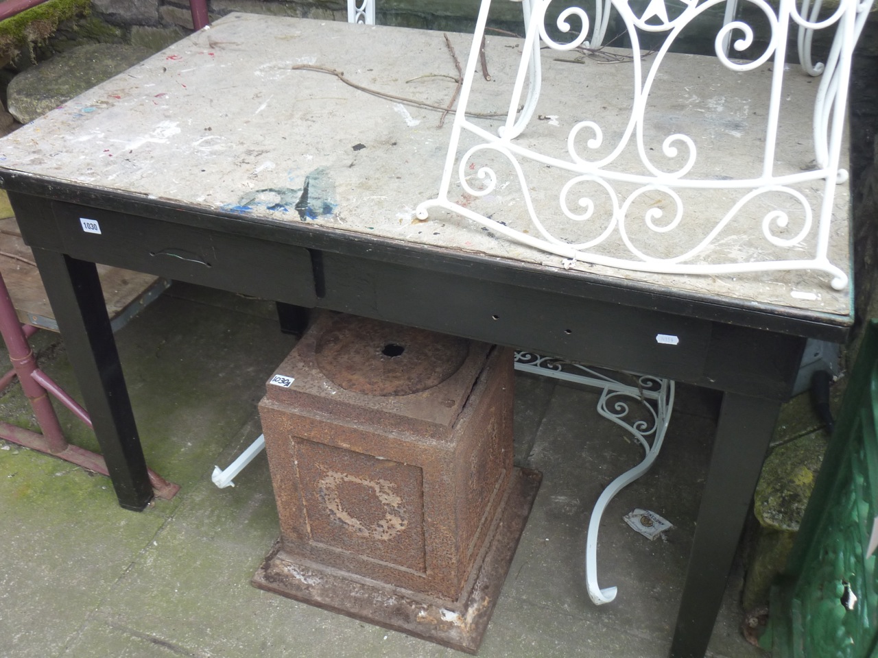 A vintage painted industrial steel framed work table of rectangular form with two frieze drawers