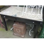 A vintage painted industrial steel framed work table of rectangular form with two frieze drawers