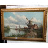 A 19th century oil painting on canvas of a Dutch canal scene with figure walking beside a