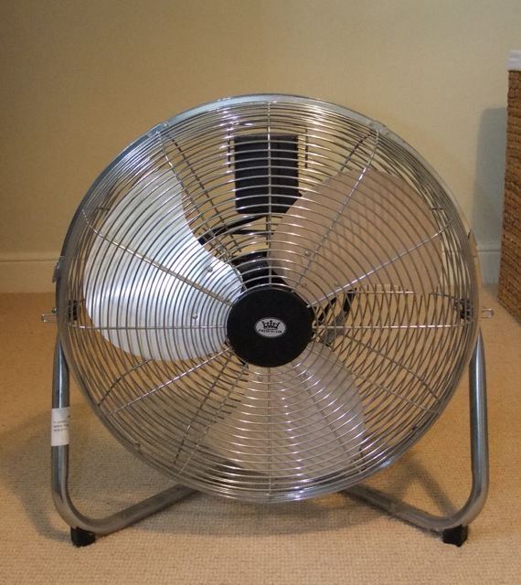 A Prem-I-ere 18 inch air circulator in a chrome cage on tripod base