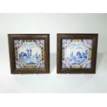 A pair of 19th century tin glazed earthenware tiles with painted harbour scene decoration within