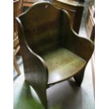 An oak chair with shaped outline and solid seat and back, labelled to reverse "Homettes"