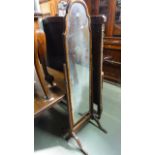 A Queen Anne style walnut veneered cheval glass on reeded frame