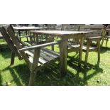 A small rustic pine garden table, two seat bench with two matching arm chairs