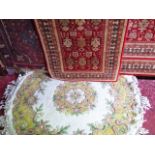 A collection of six various floral rugs to include an Afghan wool rug, three further contemporary