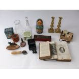 A mixed miscellaneous lot to include Russian dolls, candlesticks, keys, dominos, books, tins etc