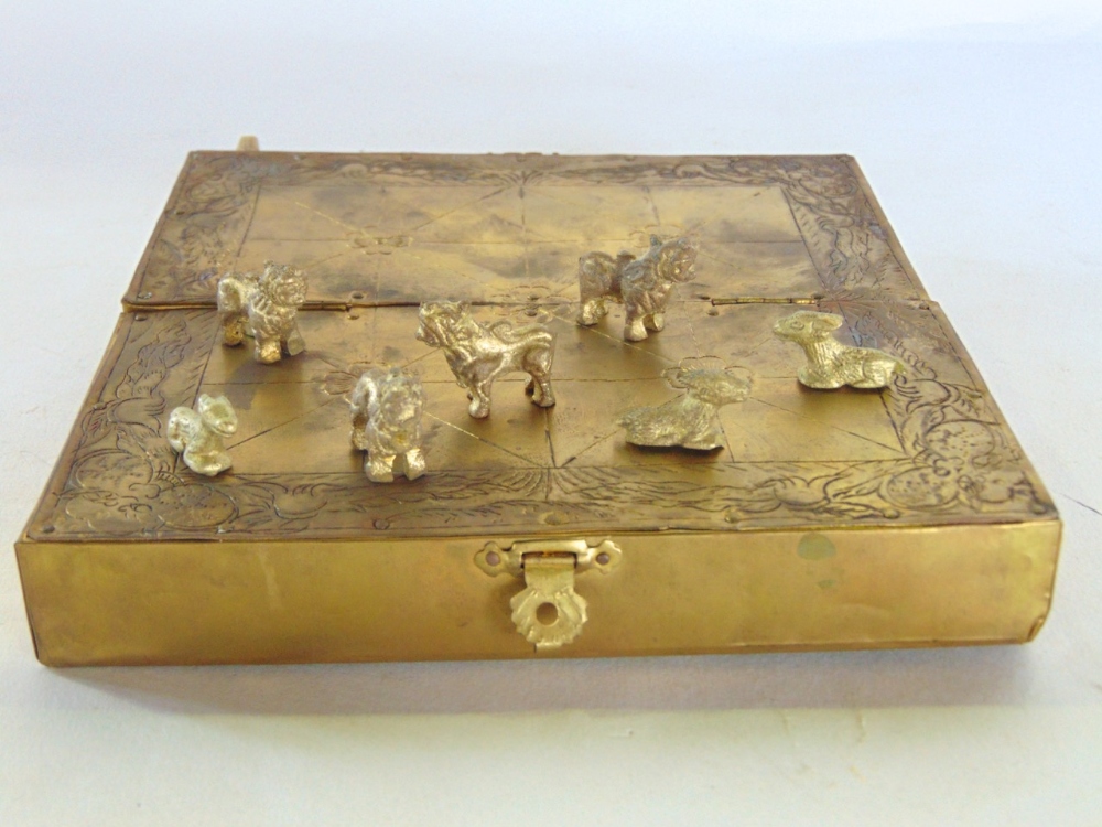 Interesting Eastern folded brass game set, a sealed hatch revealing miniature gilt metal figures - Image 2 of 3