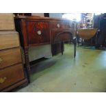 A Georgian mahogany bow fronted sideboard, the two central doors flanked by a cupboard and