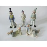 An extensive collection of ceramic models of clowns in the Lladro and Nao manner including