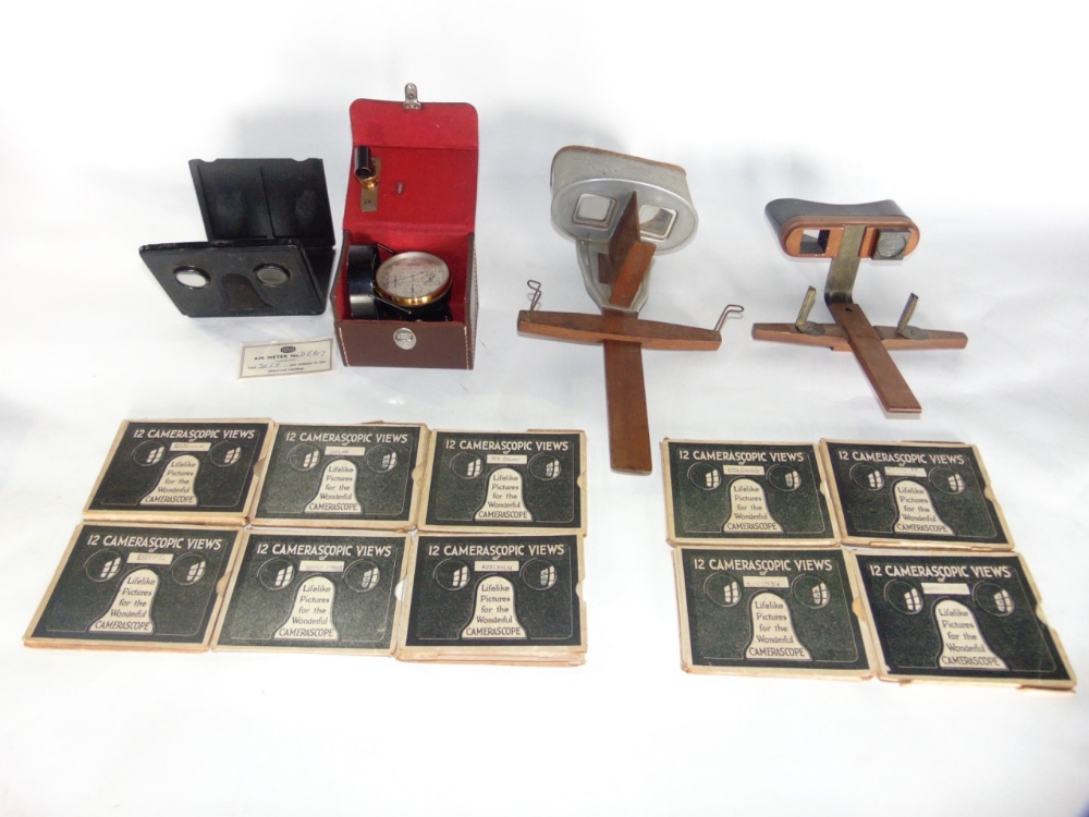 Three various stereoscopes together with a collection of slides and cased air meter by Casella of