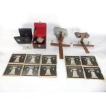 Three various stereoscopes together with a collection of slides and cased air meter by Casella of