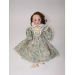 An antique S. F. B. J. porcelain headed doll, 18 inches long, with shutting eyes, open mouth and