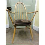 A set of six Ercol light elm Windsor dining chairs to include two carvers