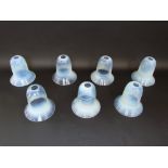 A set of seven early 20th century opalescent glass shades of bell shaped form, 14 cm tall approx