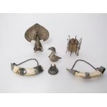 A collection of novelty Indian/Asian white metal items to include a pair of mounted boars tusks, a