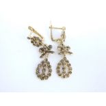 A pair of 9ct gold and marcasite drop pendant earrings with continental gold marks, (worn,