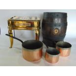 Good 19th century brass footman together with a set of three graduated copper pans and an oak and