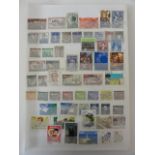 Seven albums containing a large quantity of British and other worldwide stamps including some mint