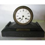 A Victorian black slate twin train mantle clock, the four inch circular dial fitted with a stepped