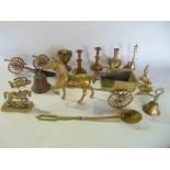 A box containing a collection of brass metalware to include cast brass horse and cart