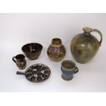 A collection of Studio Pottery wares including a large ewer with mottled green and brown glazed