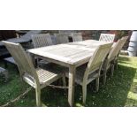 A Barlow Tyrie garden table with additional leaf together with eight matching chairs and parasol