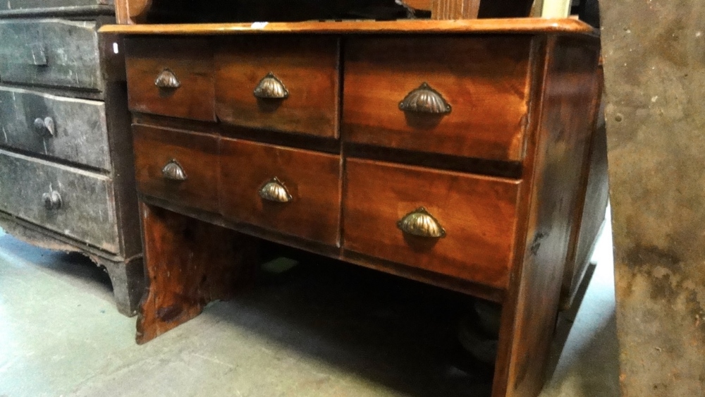A vintage pine shop counter fitted with six frieze drawers and open base, 110 cm wide