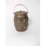 Indian white metal biscuit barrel, geometrically embossed with panels of an Indian deity, 14 oz