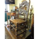 An early 18th century Yorkshire side chair in oak with carved and shaped detail and applied