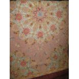 A good quality needlework rug centrally decorated with flowers amidst flying insects and further