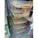 Two vintage wire work filing trays, each of six tiers, in a cream and red colourway and a further