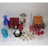 A collection of glassware including a turquoise Dartington glass jar with moulded flower head detail